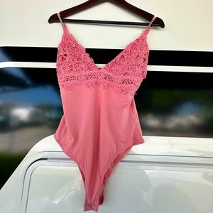 NWT Blush Lace Bodysuit Size Medium.